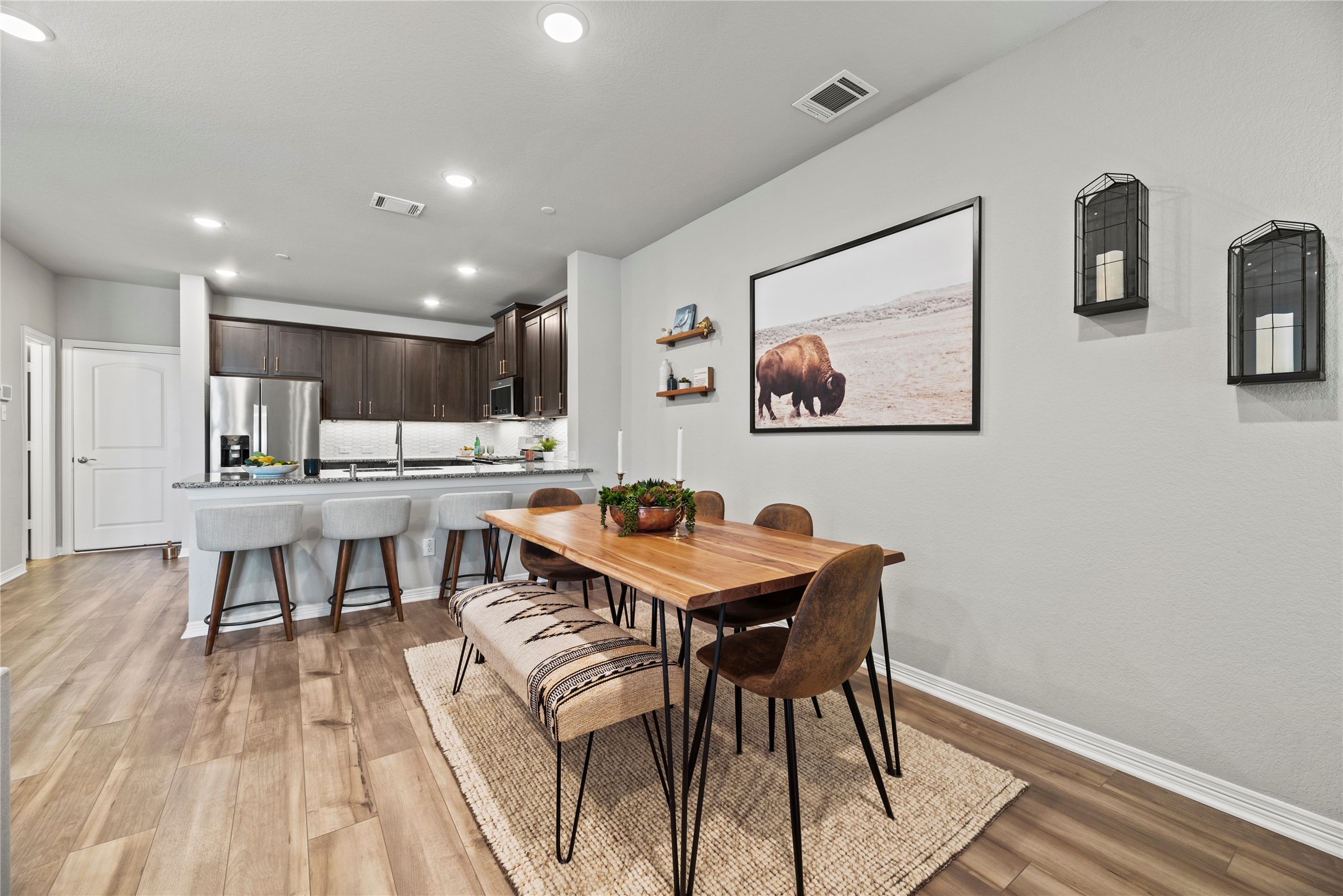 8001 Scanlan Trail Missouri City, TX 77459 - Photo 6 of 41 a view of a dining room with furniture and wooden floor