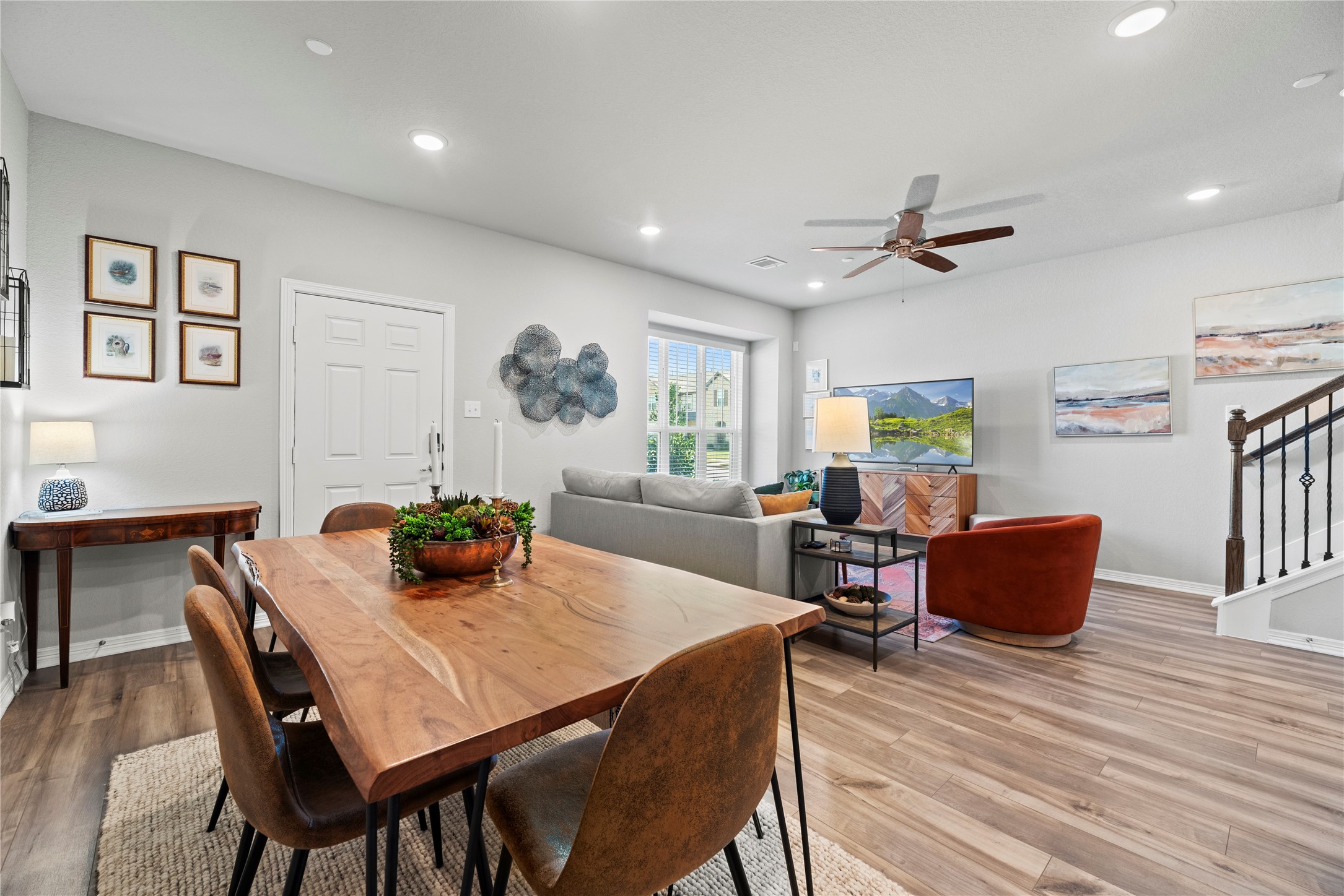 8001 Scanlan Trail Missouri City, TX 77459 - Photo 9 of 41 a view of a dining room with furniture and wooden floor