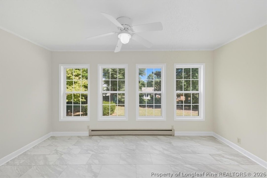 2604 Huntington Road Fayetteville, NC 28303 - Photo 17 of 46 a view of an empty room with a window and kitchen view