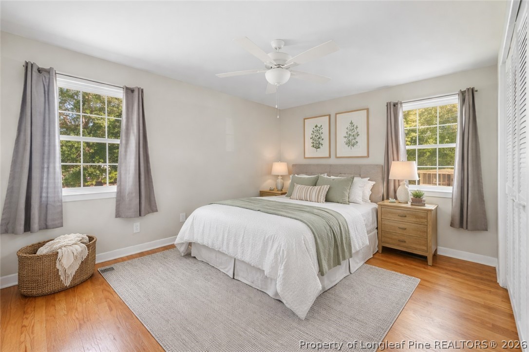2604 Huntington Road Fayetteville, NC 28303 - Photo 22 of 46 a bedroom with a bed and wooden floor
