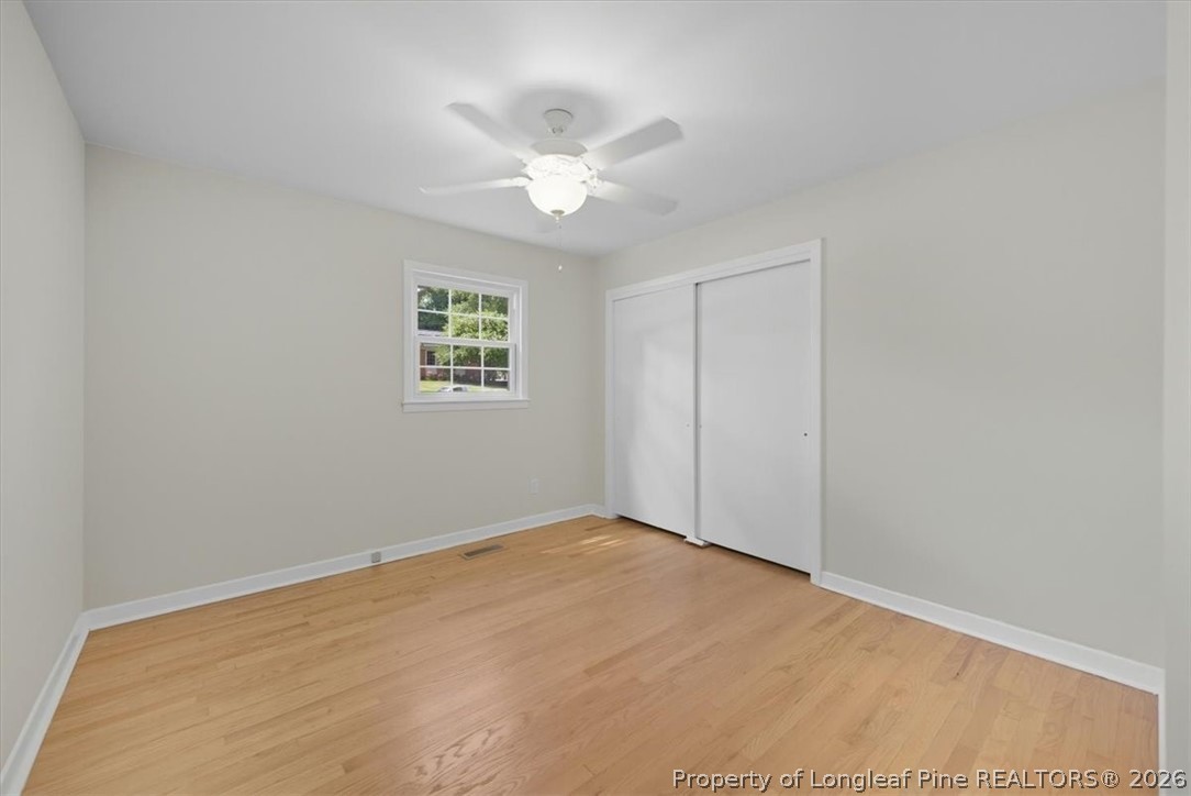 2604 Huntington Road Fayetteville, NC 28303 - Photo 27 of 46 an empty room with a window and a fan