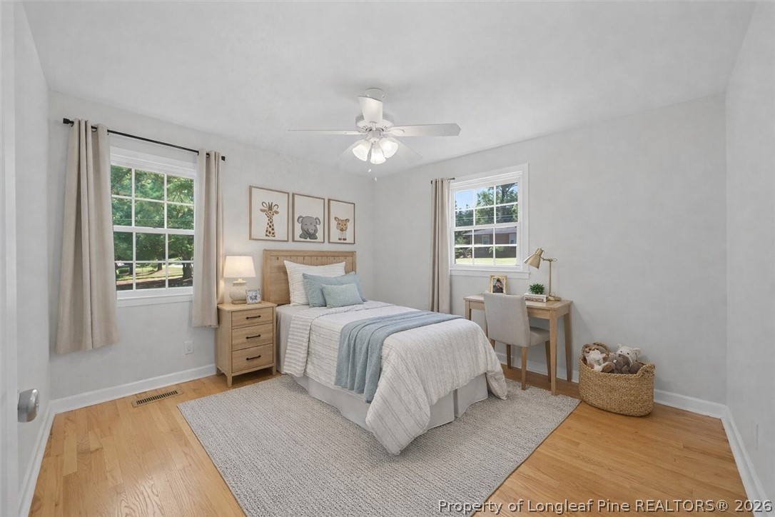 2604 Huntington Road Fayetteville, NC 28303 - Photo 29 of 46 a bedroom with a bed and a large window