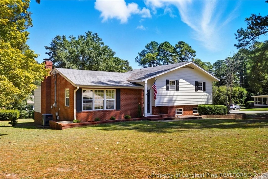 2604 Huntington Road Fayetteville, NC 28303 - Photo 39 of 46 a front view of house with yard and trees in the background
