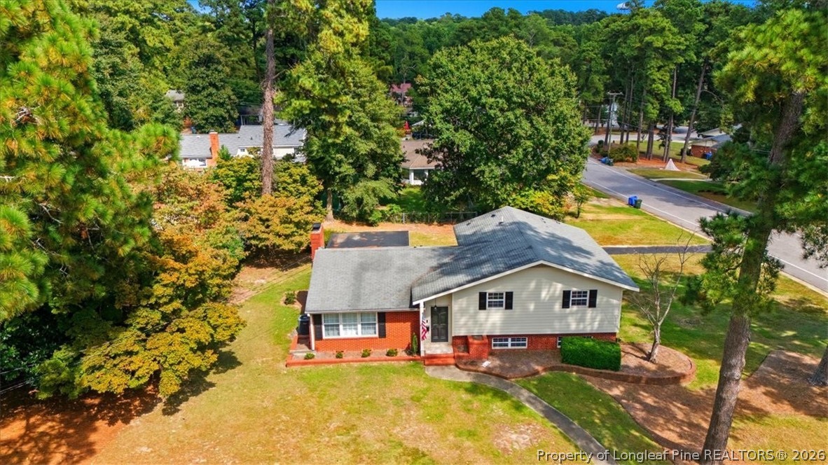 2604 Huntington Road Fayetteville, NC 28303 - Photo 42 of 46 an aerial view of a house with a big yard and large trees