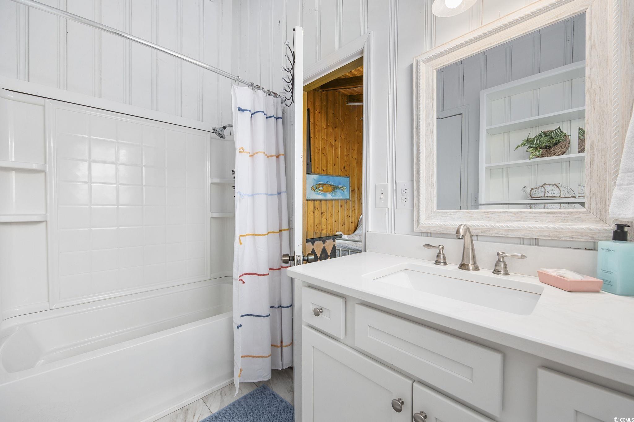 222 Calhoun Drive Murrells Inlet, SC 29576 - Photo 16 of 40 Bathroom with vanity and shower / tub combo with curtain