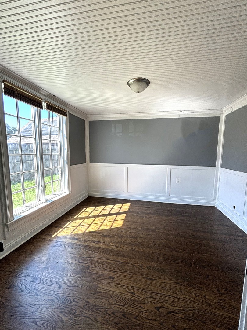 115 Saugatuck Road Montgomery, IL 60538 - Photo 11 of 17 a view of empty room with wooden floor and fan