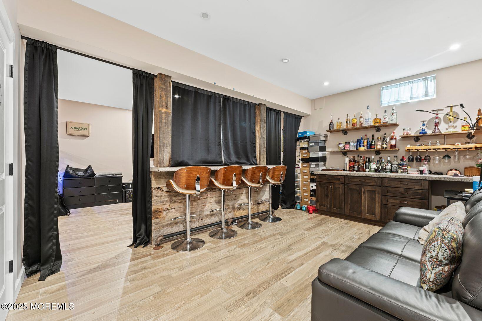 24 Friendship Road Howell, NJ 07731 - Photo 25 of 34 a living room with a couch and a table