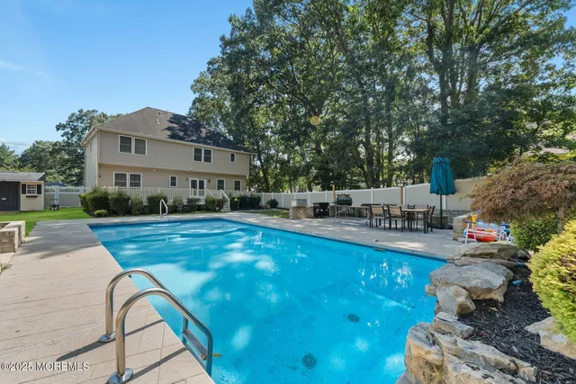 a view of a swimming pool with a patio
