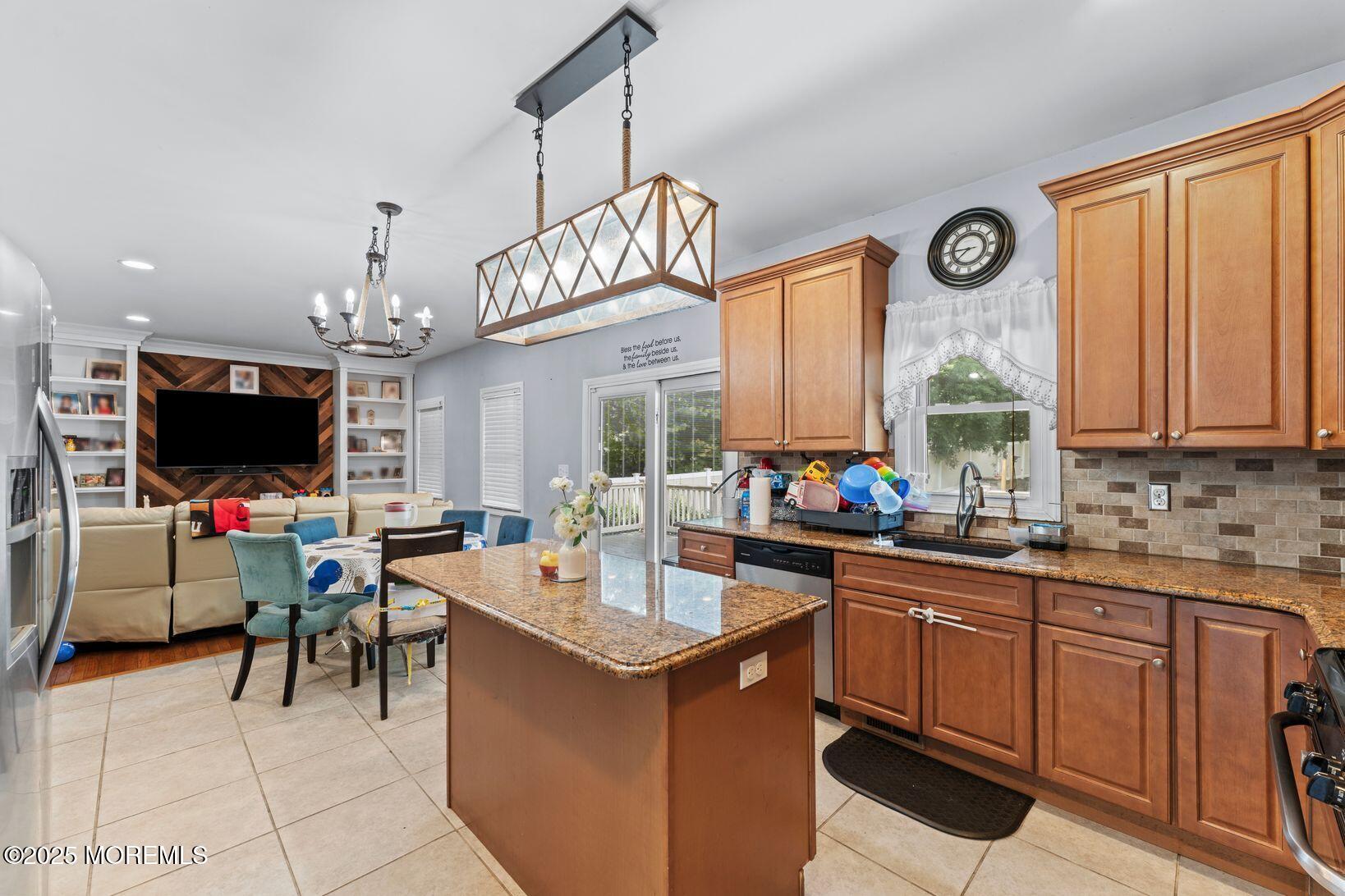 24 Friendship Road Howell, NJ 07731 - Photo 5 of 34 a open kitchen with a sink a counter top appliances and cabinets