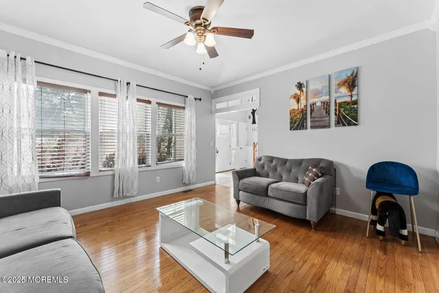 a living room with furniture and windows