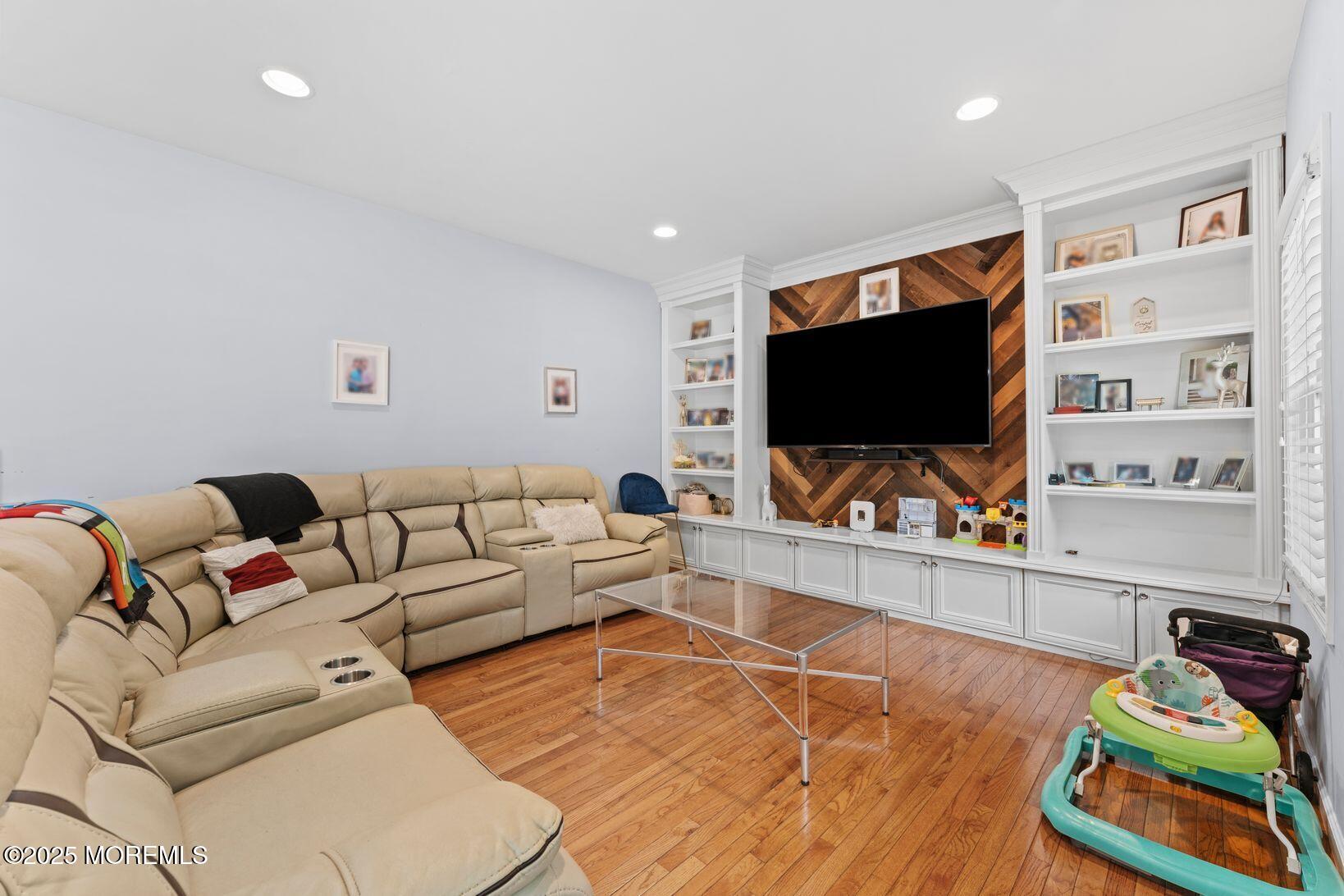24 Friendship Road Howell, NJ 07731 - Photo 10 of 34 a living room with furniture and a flat screen tv
