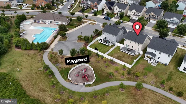 an aerial view of residential house with outdoor space and parking