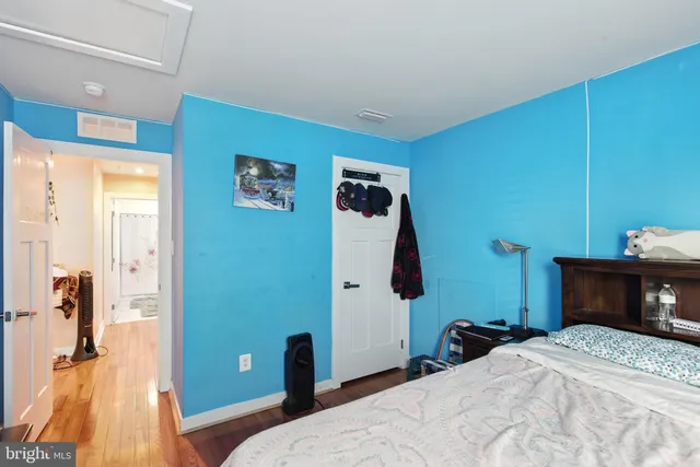 a bedroom with a bed and a table