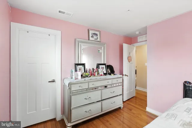 a room with a dresser in it