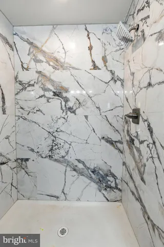 a bathroom with a sink mirror vanity and toilet