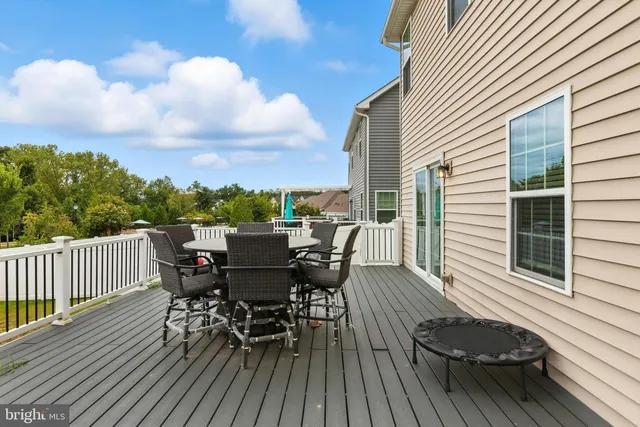 a view of a swimming pool with a lawn chairs