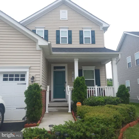 a view of a house with a yard and plants