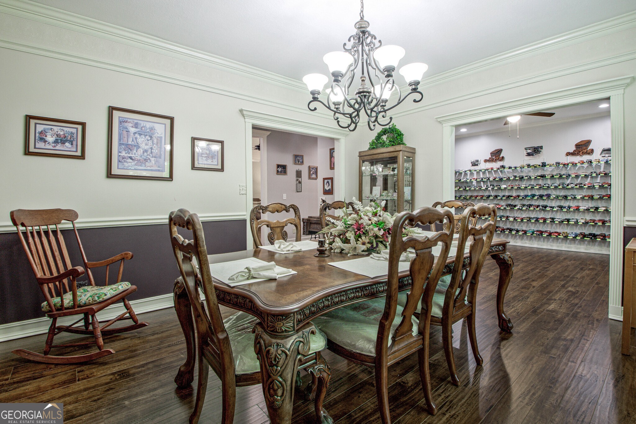 967 Tope Road Sharpsburg, GA 30277 - Photo 14 of 98 a view of a dining room with furniture a chandelier and wooden floor