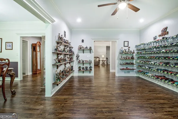 a kitchen with sink cabinets and wooden floor