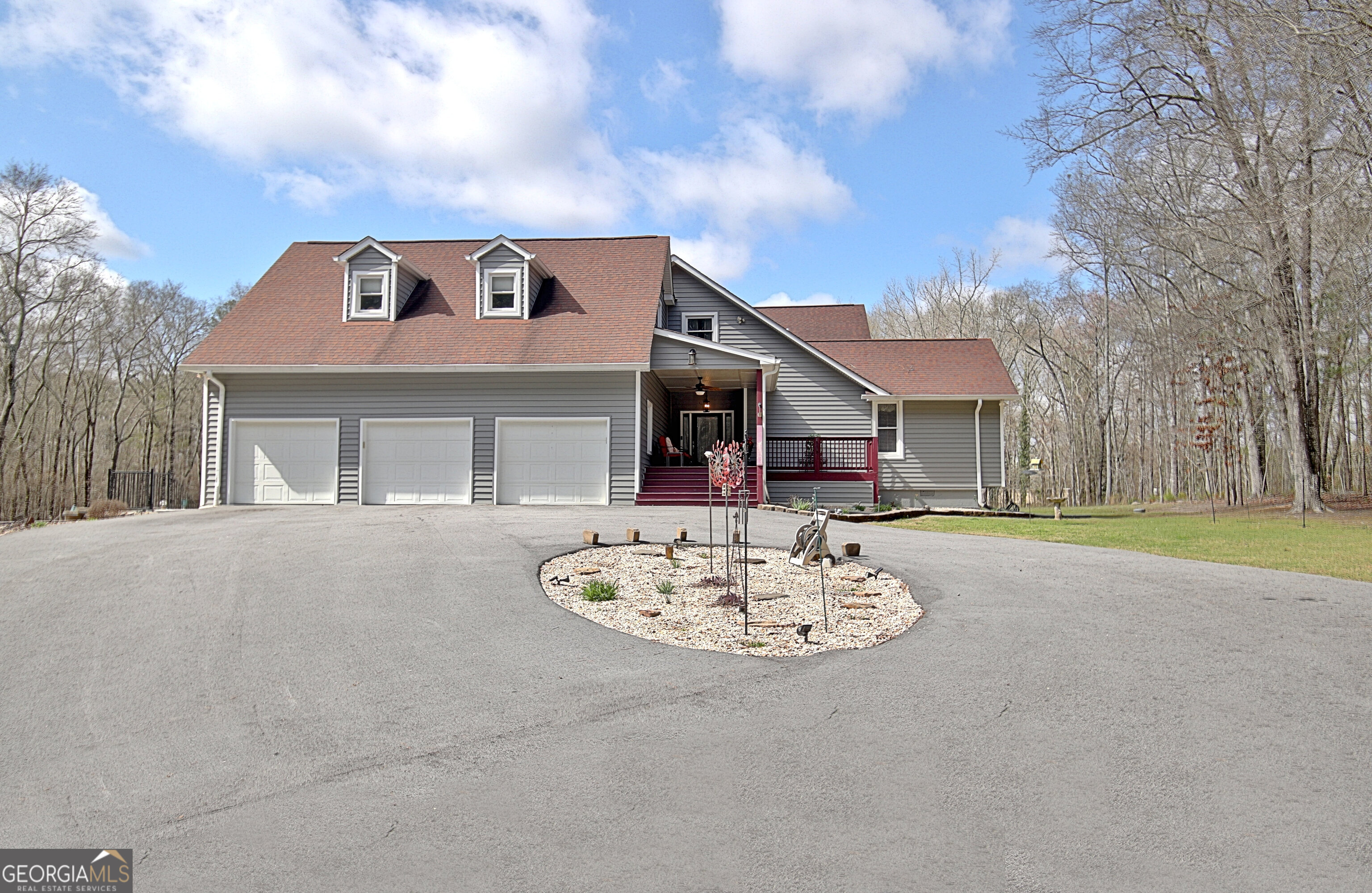 967 Tope Road Sharpsburg, GA 30277 - Photo 2 of 98 a front view of a house with a yard and a garage