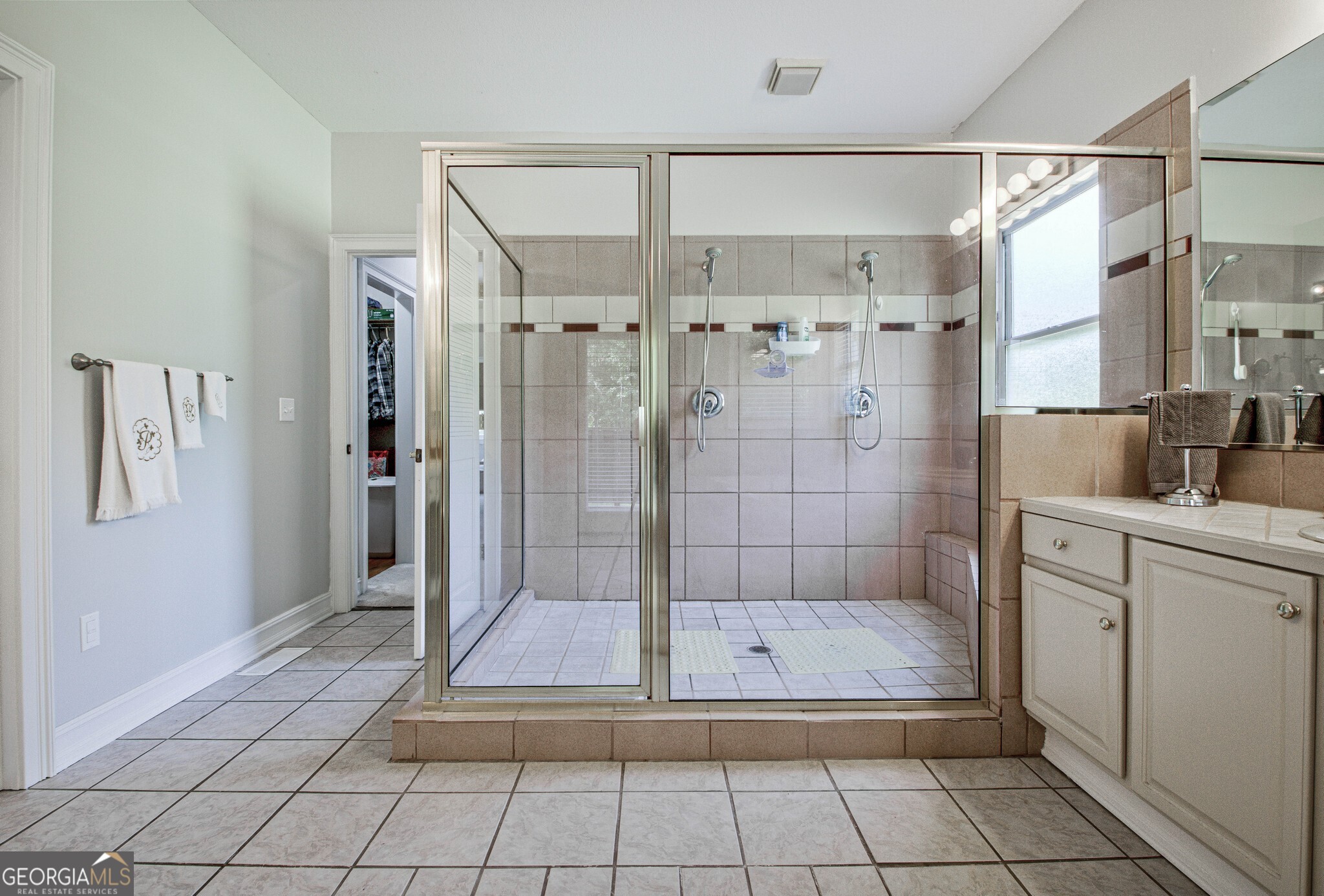 967 Tope Road Sharpsburg, GA 30277 - Photo 29 of 98 a bathroom with a shower and a sink