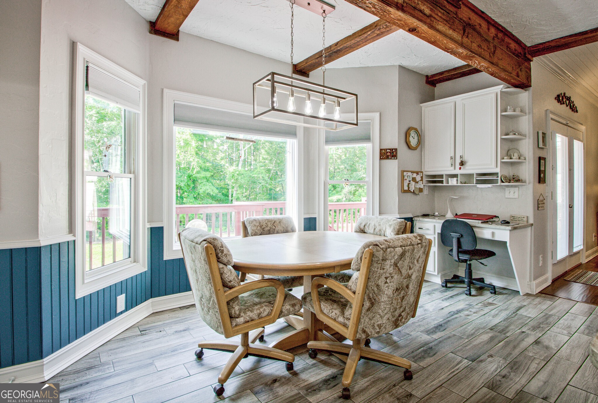 967 Tope Road Sharpsburg, GA 30277 - Photo 30 of 98 a view of a dining room with furniture window and wooden floor