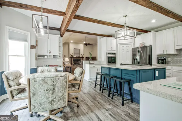 a bed room with a bed and a chandelier