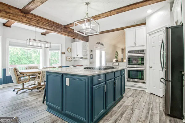 a room with furniture a rug and a flat screen tv