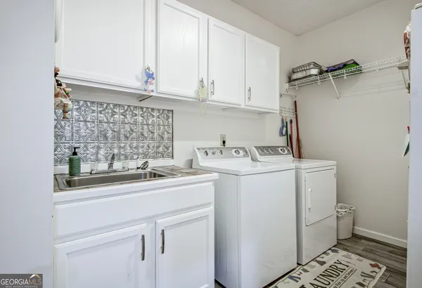 a view of fountain with a yard