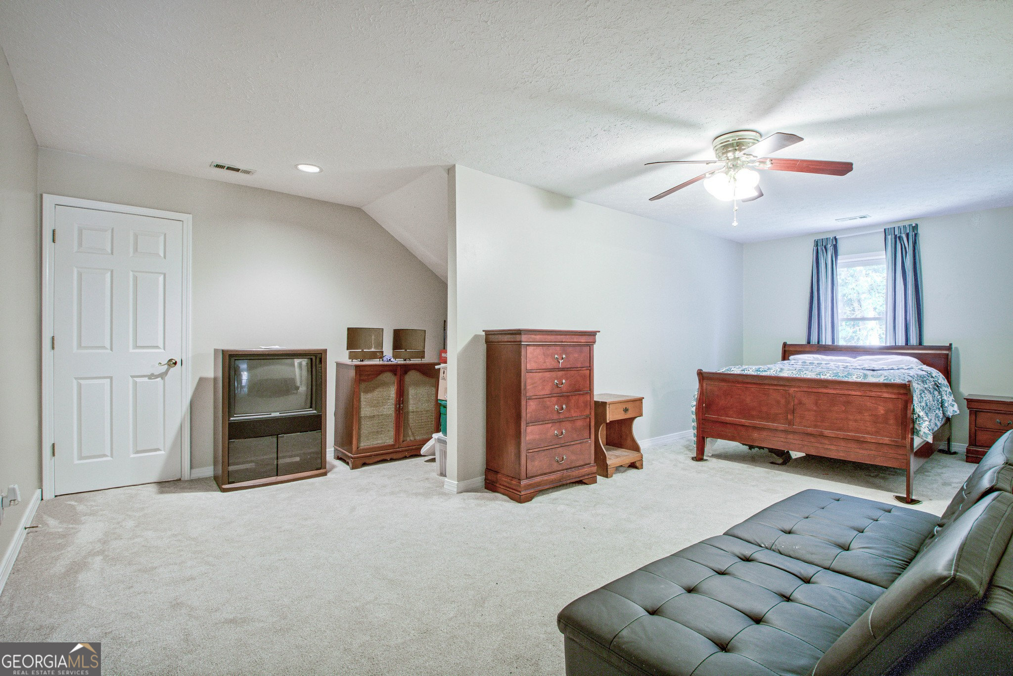 967 Tope Road Sharpsburg, GA 30277 - Photo 48 of 98 a bedroom with furniture and a ceiling fan