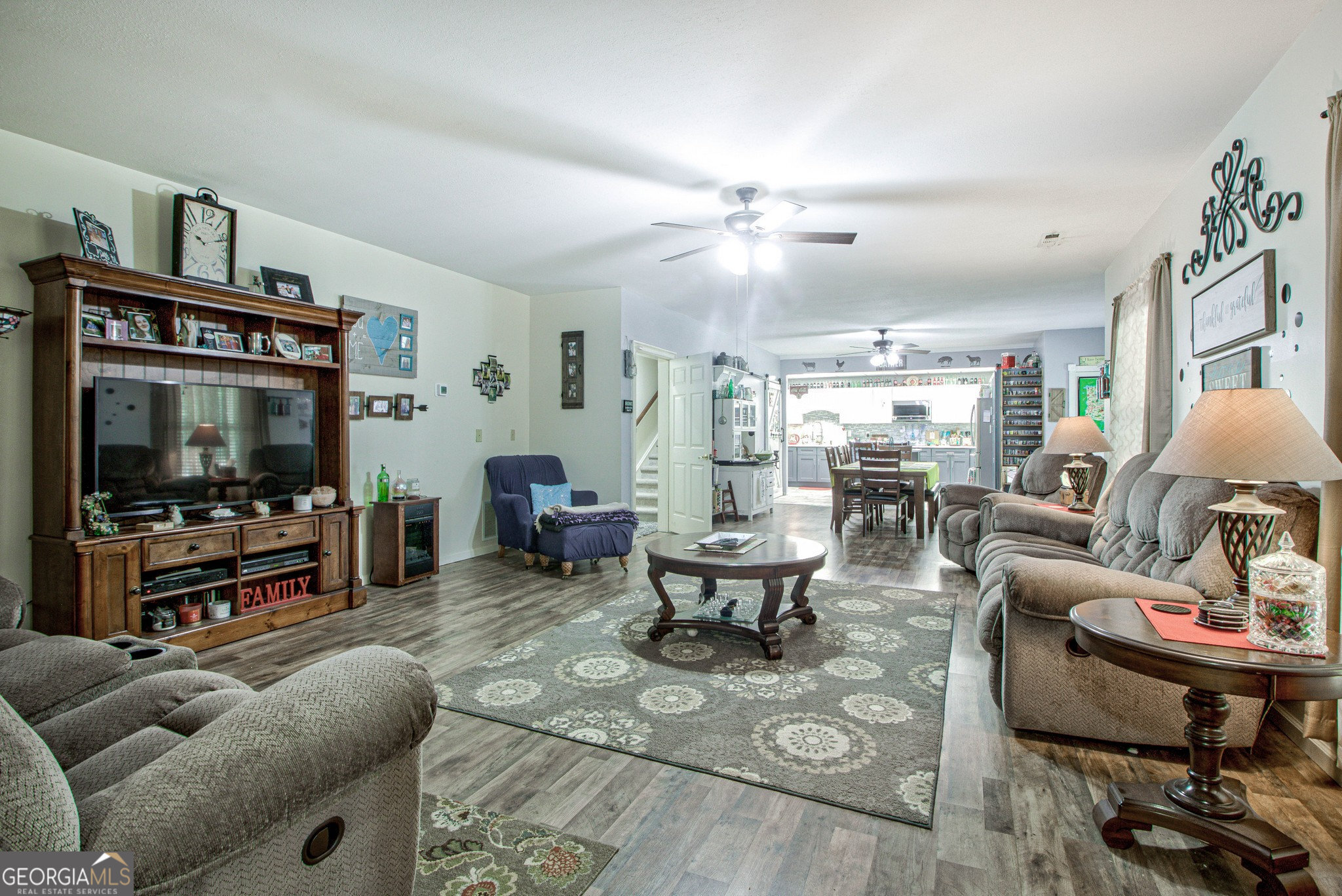 967 Tope Road Sharpsburg, GA 30277 - Photo 50 of 98 a living room with furniture and a flat screen tv