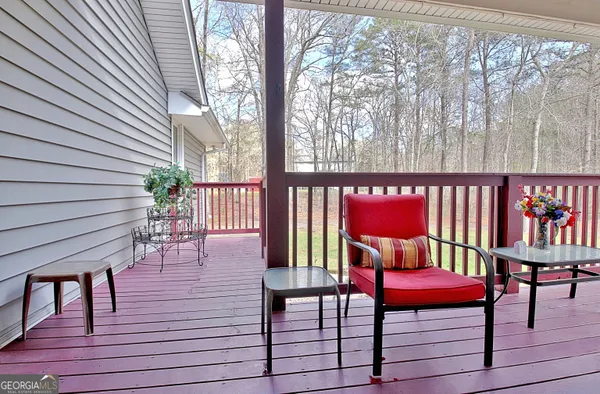 a view of a dining room with furniture a chandelier and wooden floor