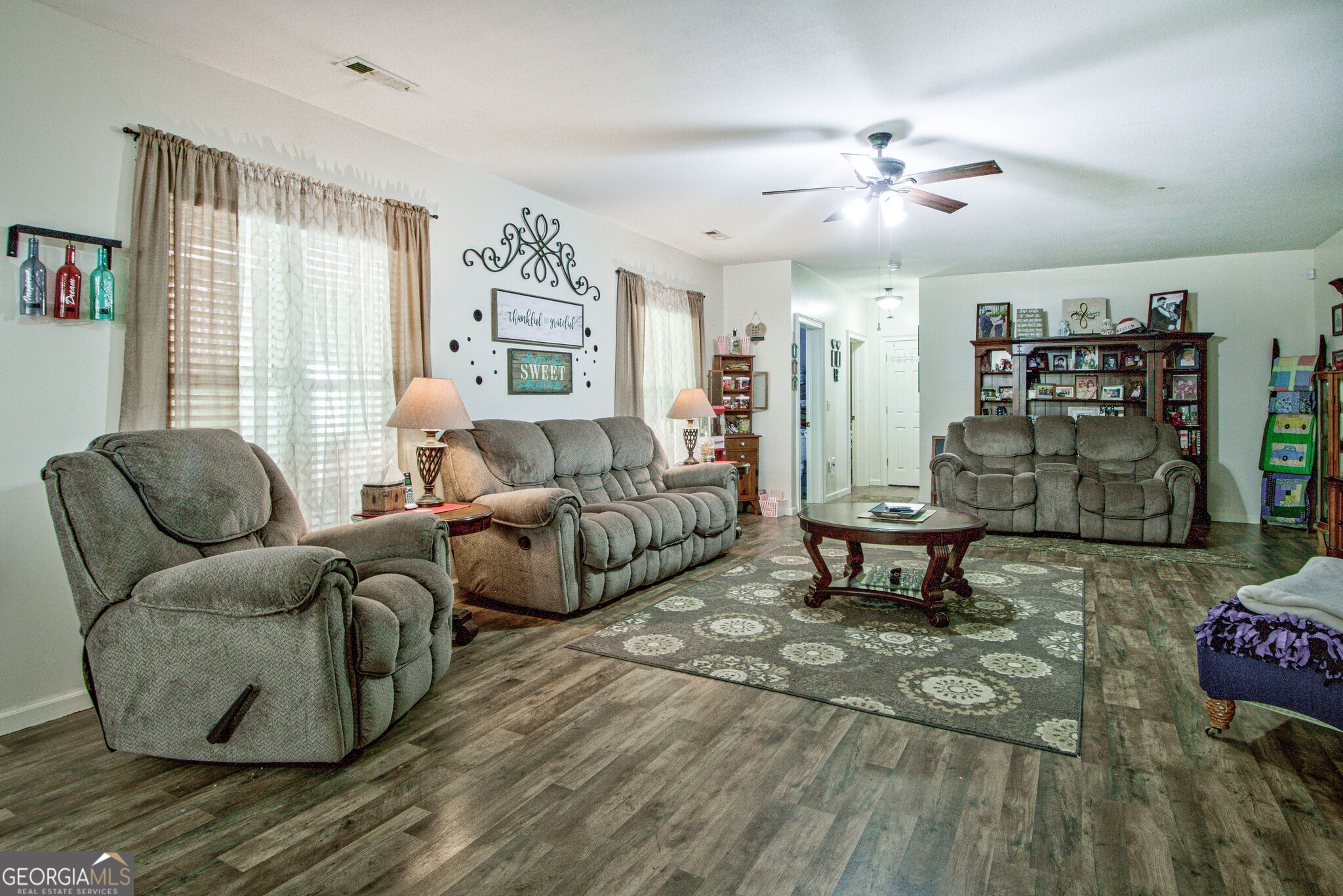 967 Tope Road Sharpsburg, GA 30277 - Photo 52 of 98 a living room with furniture and wooden floor
