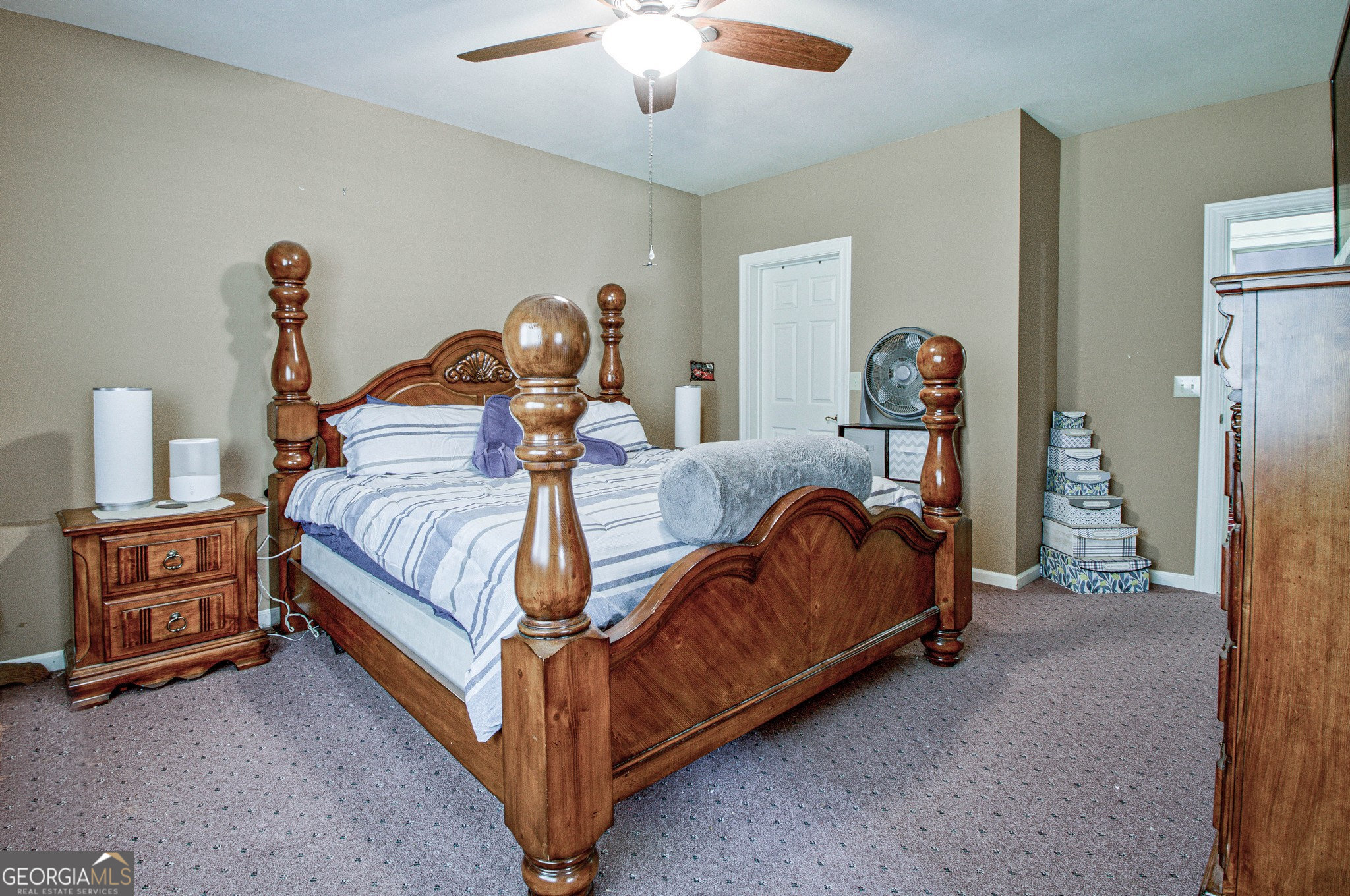 967 Tope Road Sharpsburg, GA 30277 - Photo 59 of 98 a bed room with a bed and a chandelier