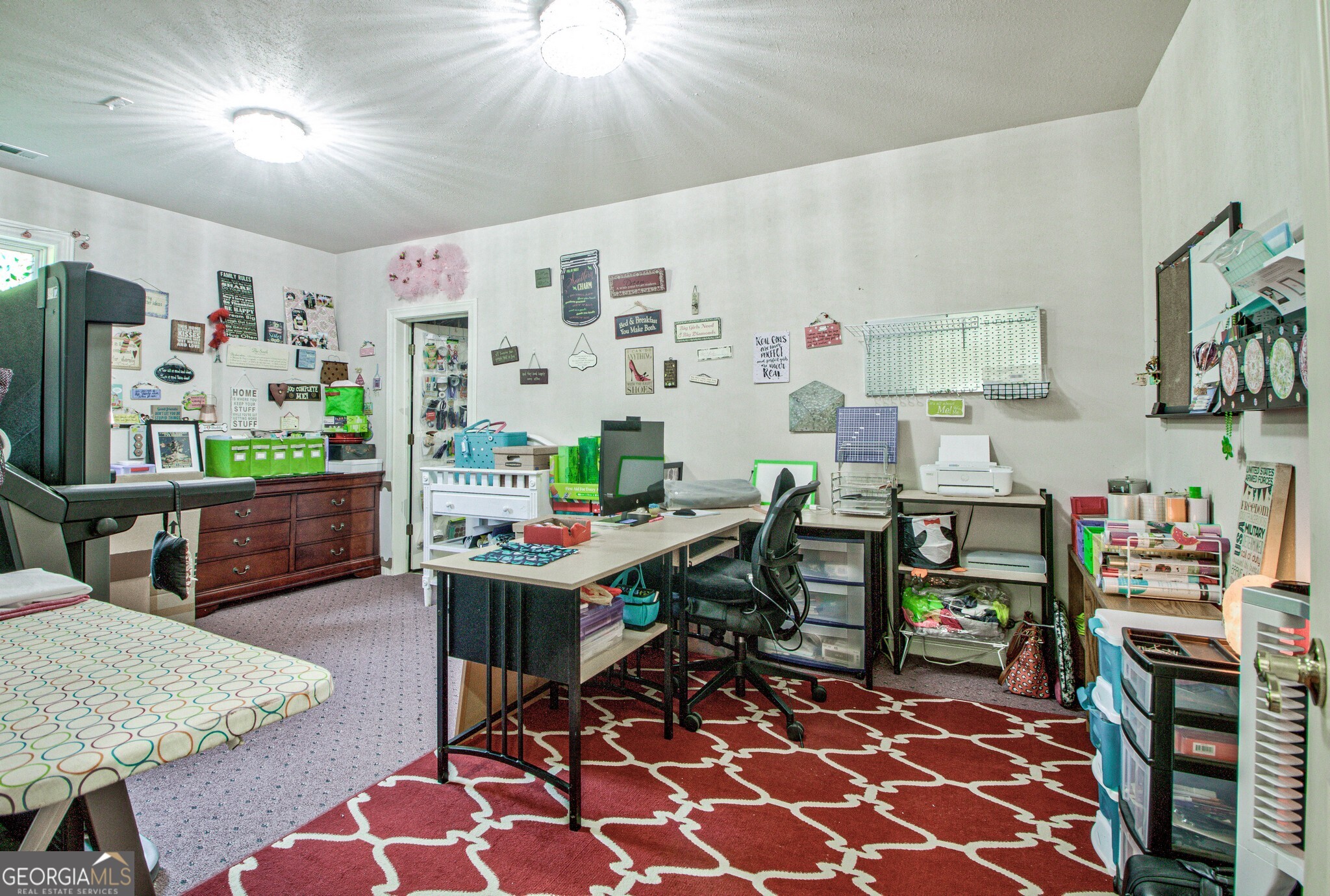 967 Tope Road Sharpsburg, GA 30277 - Photo 61 of 98 a room with furniture a rug and a flat screen tv