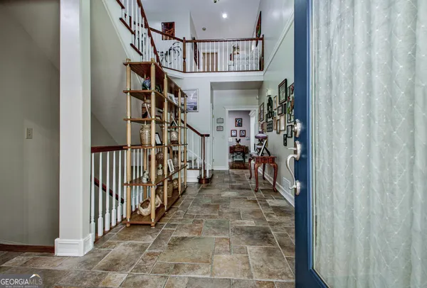 a bedroom with bed and window