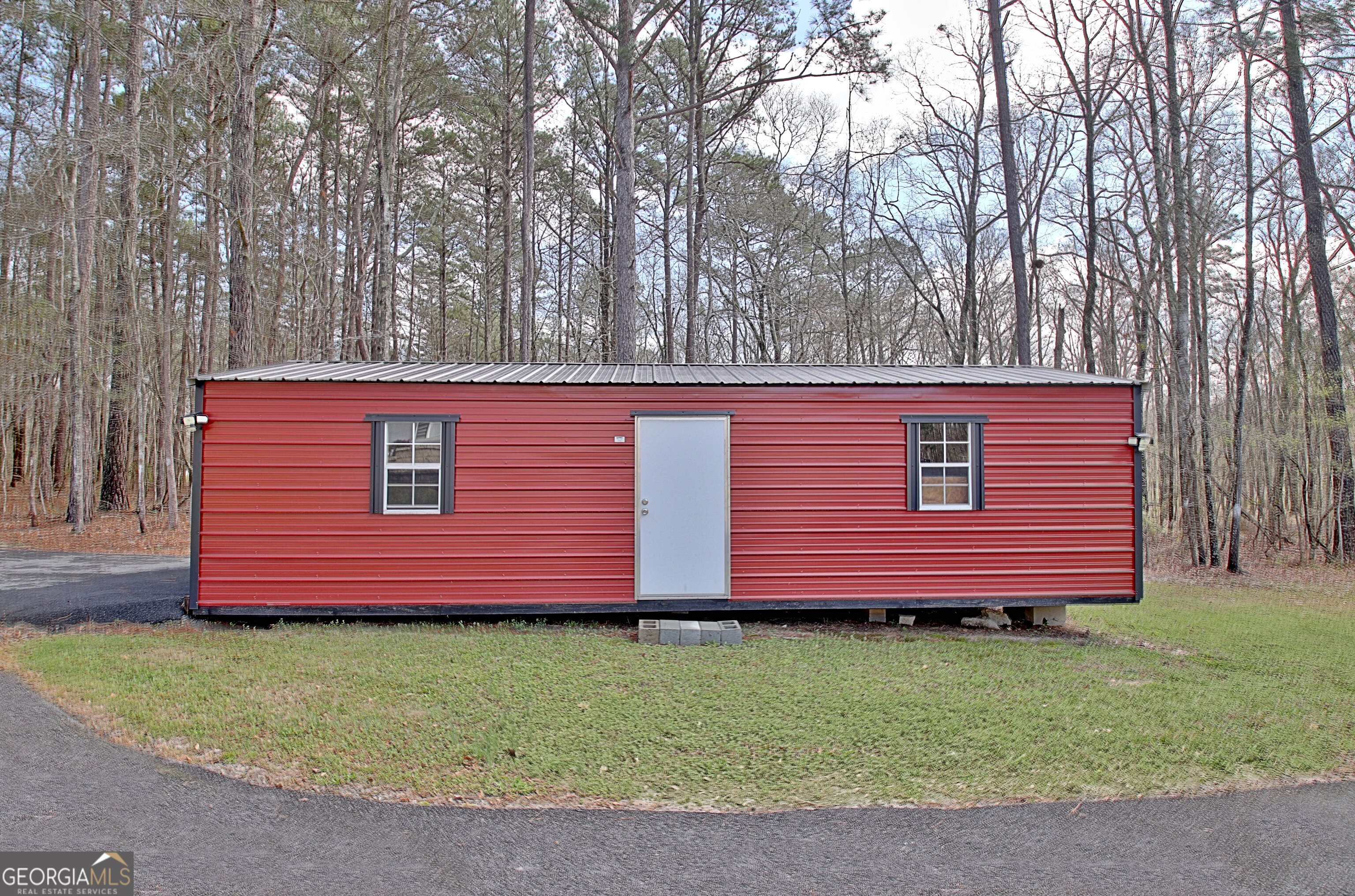 967 Tope Road Sharpsburg, GA 30277 - Photo 86 of 98 a front view of a house with a garden