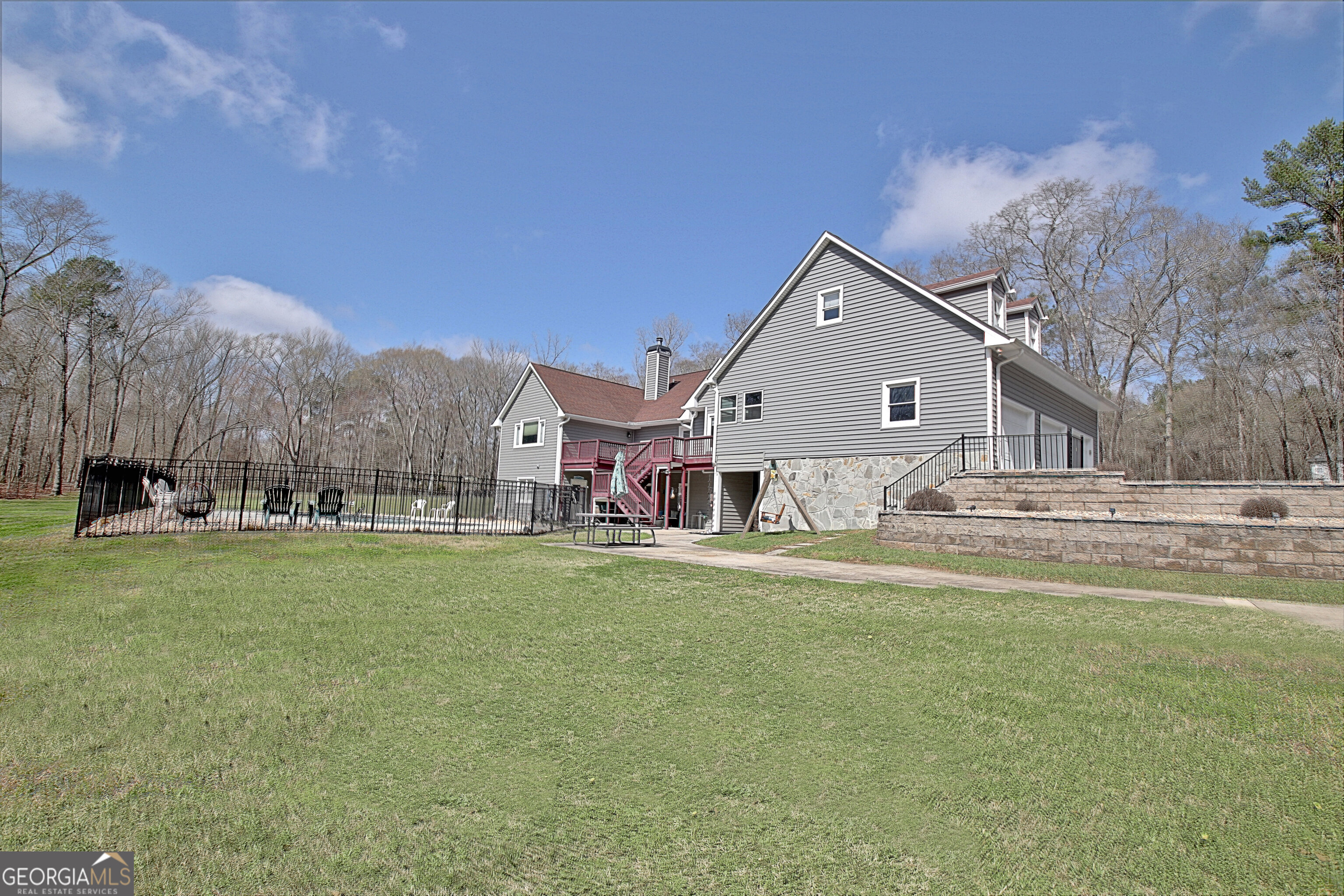 967 Tope Road Sharpsburg, GA 30277 - Photo 87 of 98 a front view of a house with a yard table and chairs