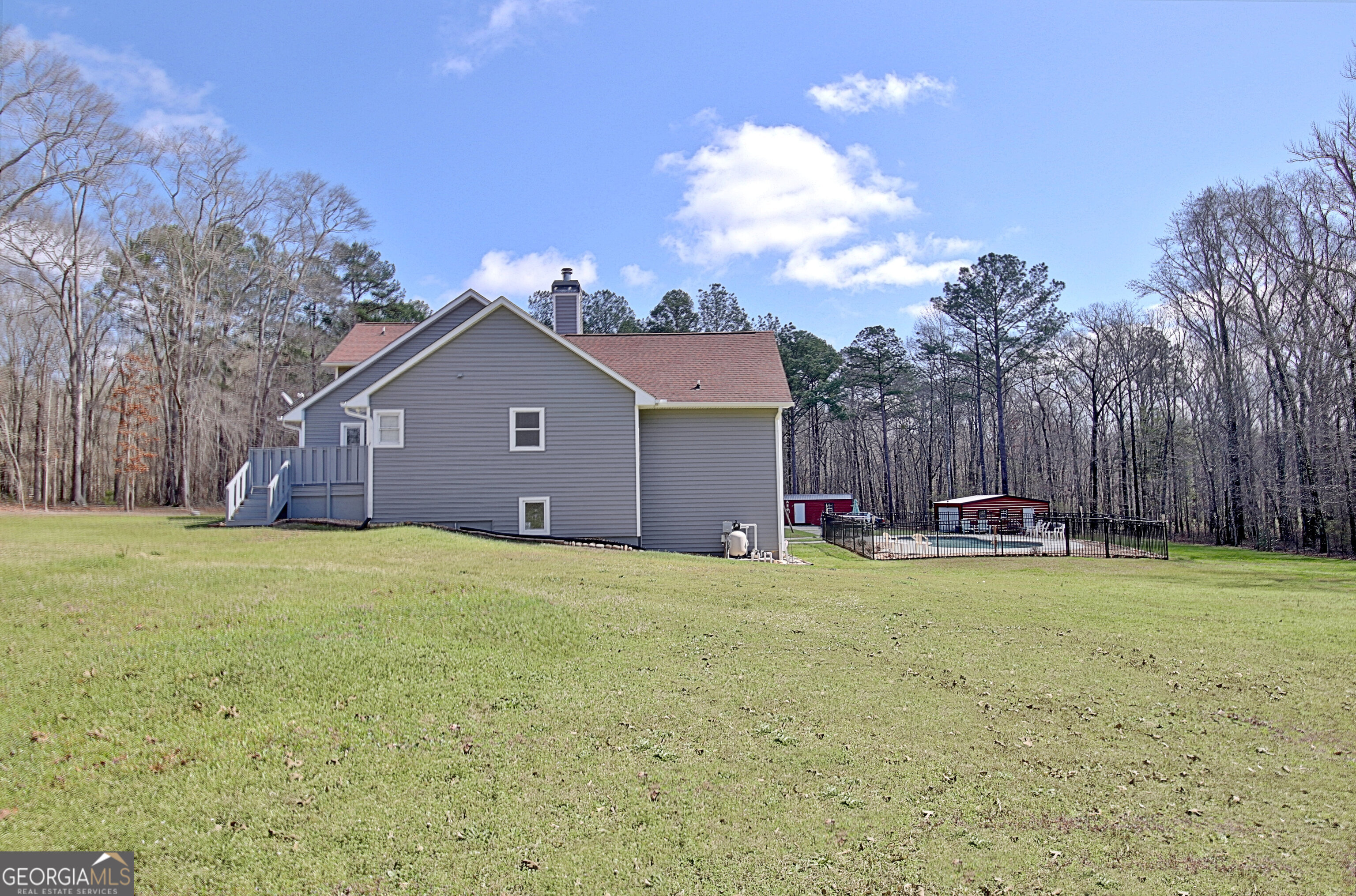967 Tope Road Sharpsburg, GA 30277 - Photo 95 of 98 a view of a house with swimming pool and a yard
