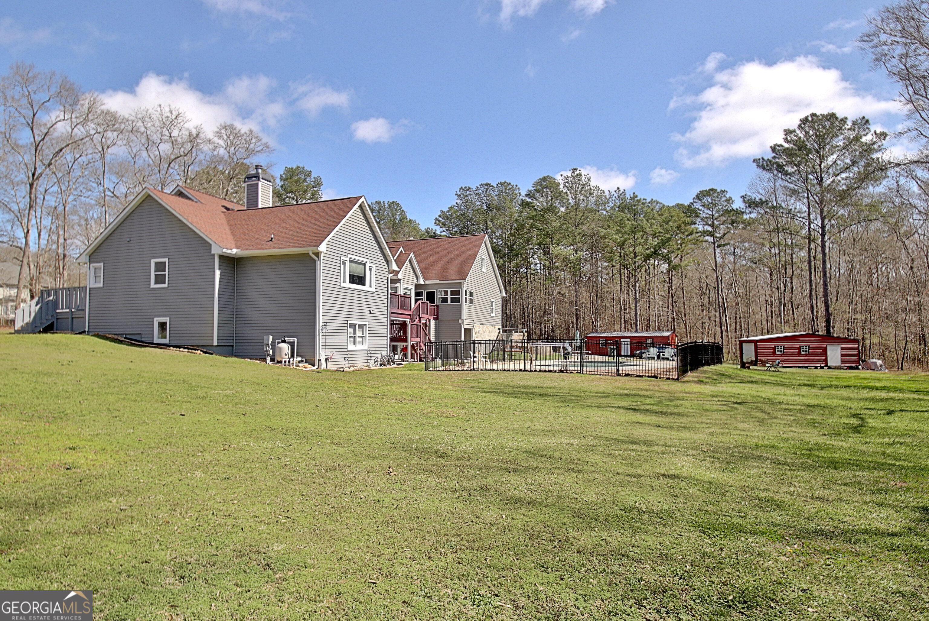 967 Tope Road Sharpsburg, GA 30277 - Photo 96 of 98 a front view of a house with a yard and garage