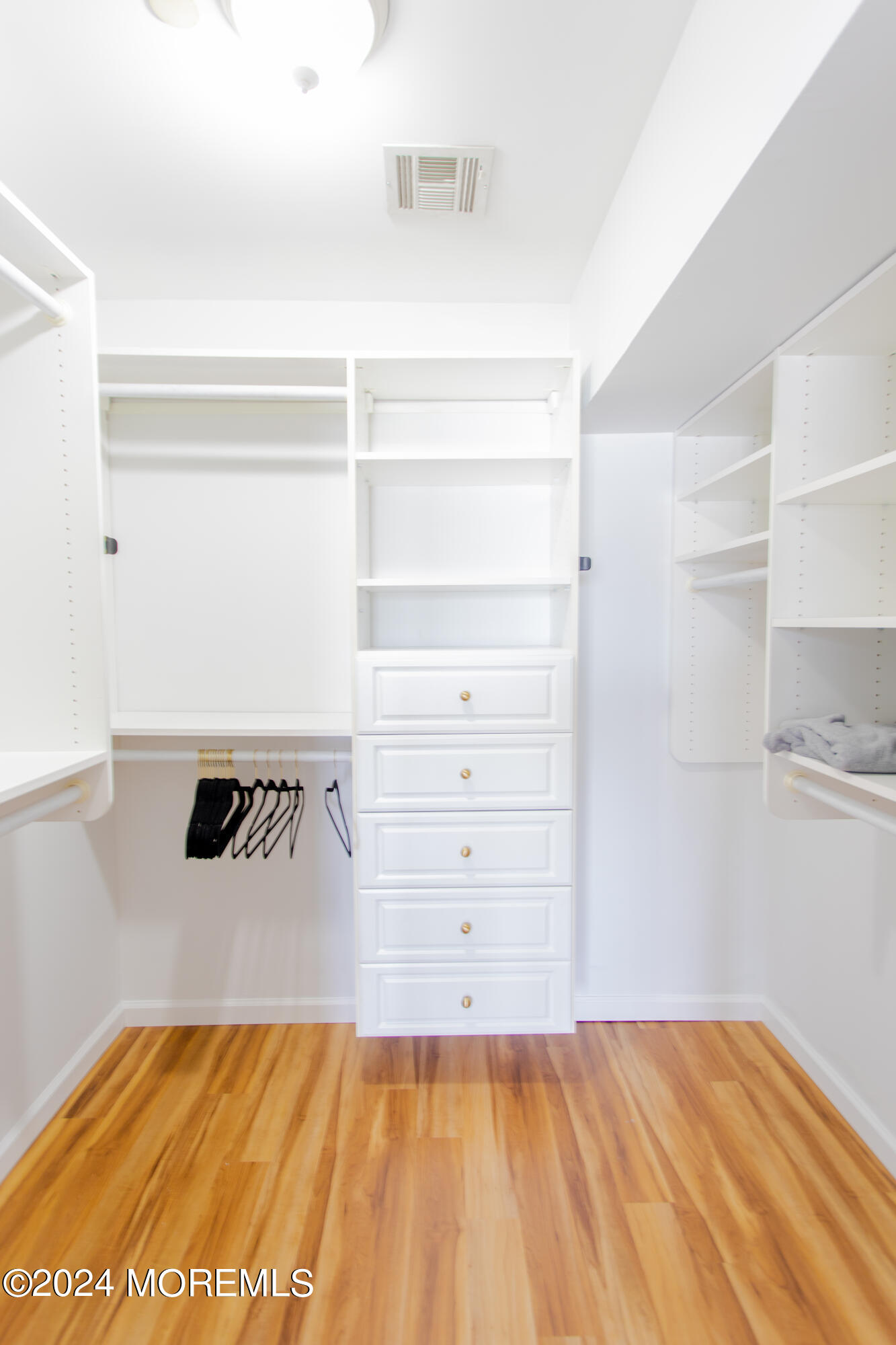 580 East Main Street, Unit 3 Manasquan, NJ 08736 - Photo 27 of 41 a view of a bedroom with closet and cabinet