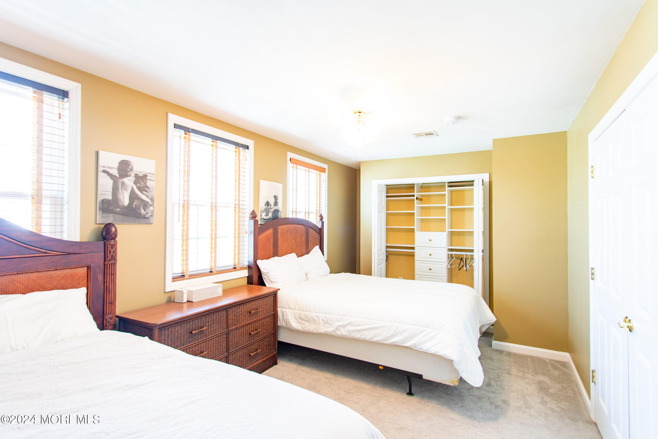 580 East Main Street, Unit 3 Manasquan, NJ 08736 - Photo 28 of 41 a bedroom with a large bed and a large window