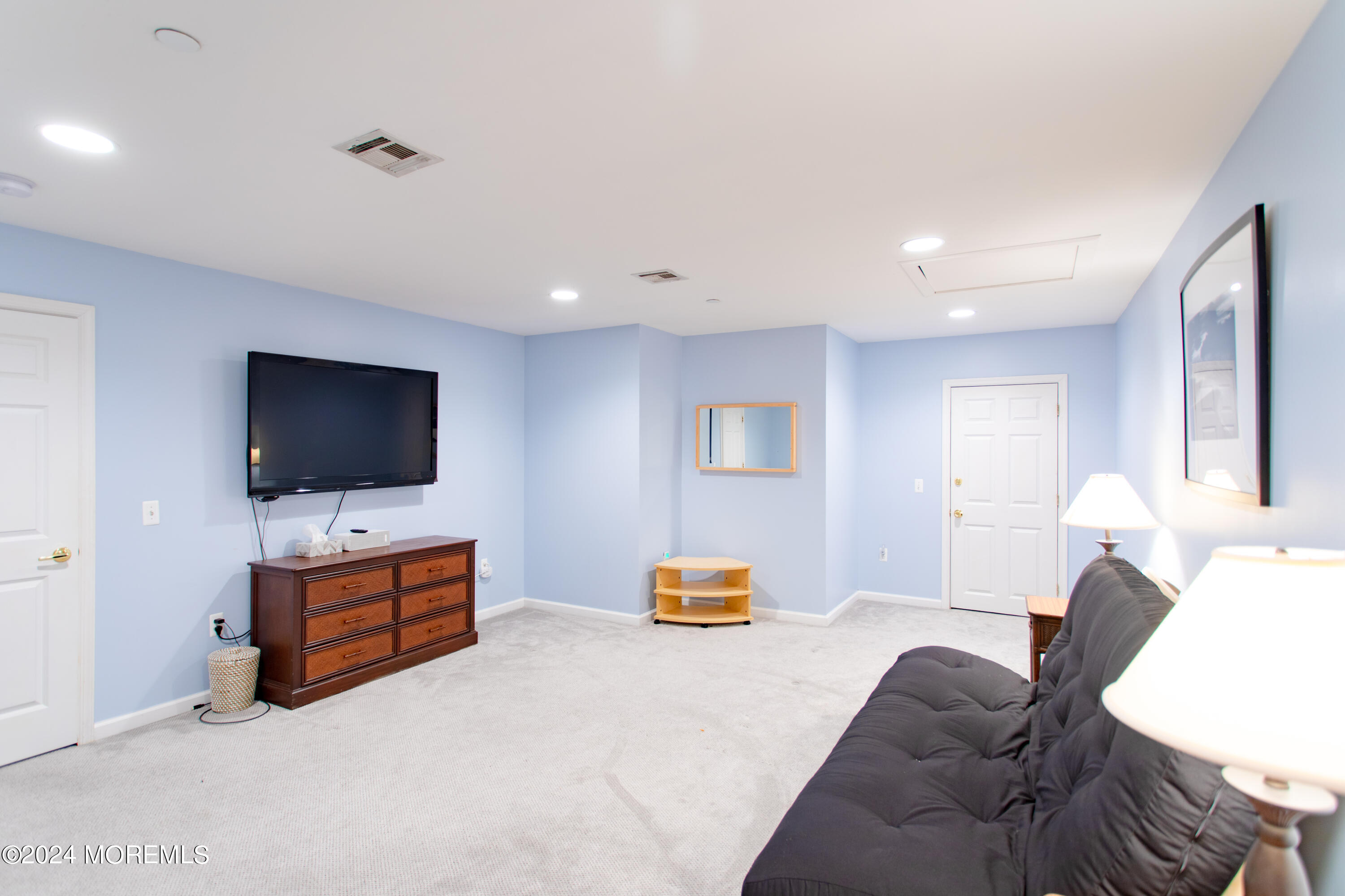 580 East Main Street, Unit 3 Manasquan, NJ 08736 - Photo 30 of 41 a living room with furniture and a flat screen tv