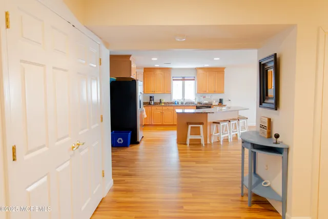 a living room with fireplace furniture and a floor to ceiling window
