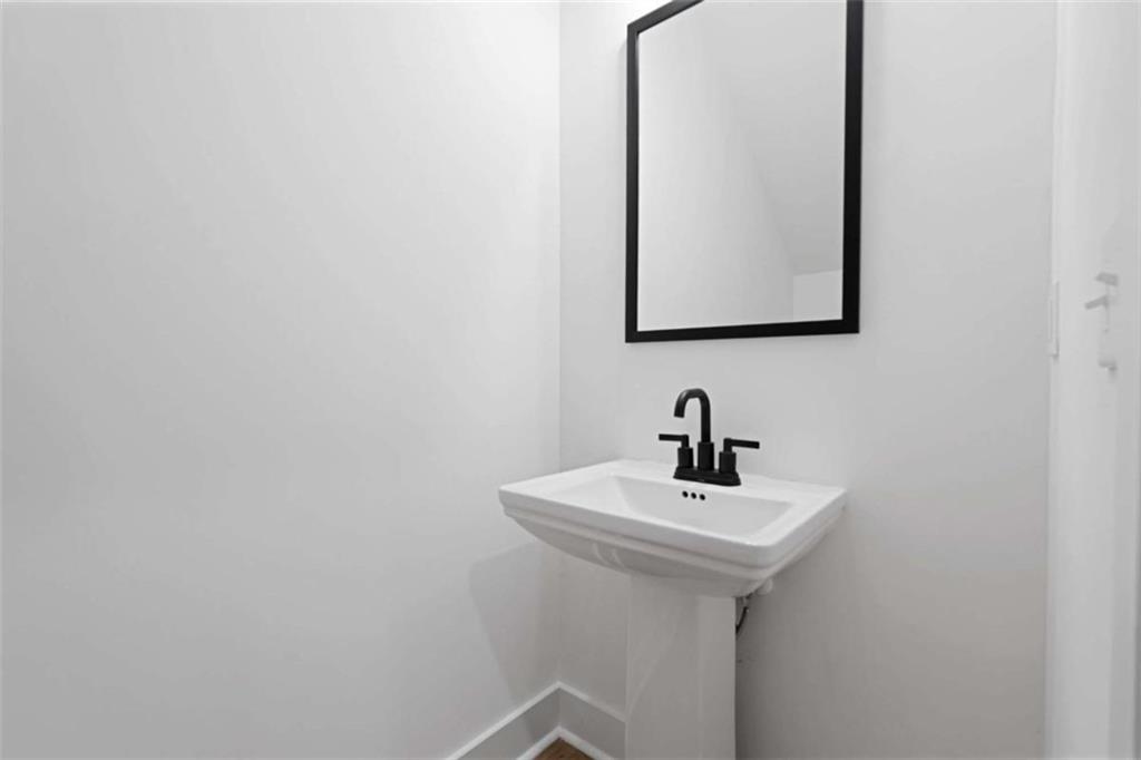 11691 Hazelbrand Road Northeast Covington, GA 30014 - Photo 29 of 53 a bathroom with a sink and mirror