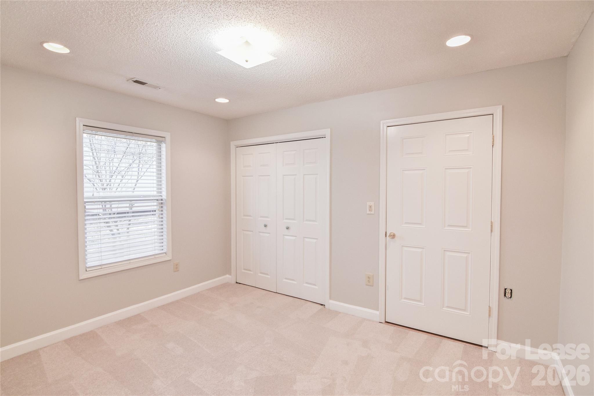 110 Pratt Street Belmont, NC 28012 - Photo 12 of 18 an empty room with windows and closet