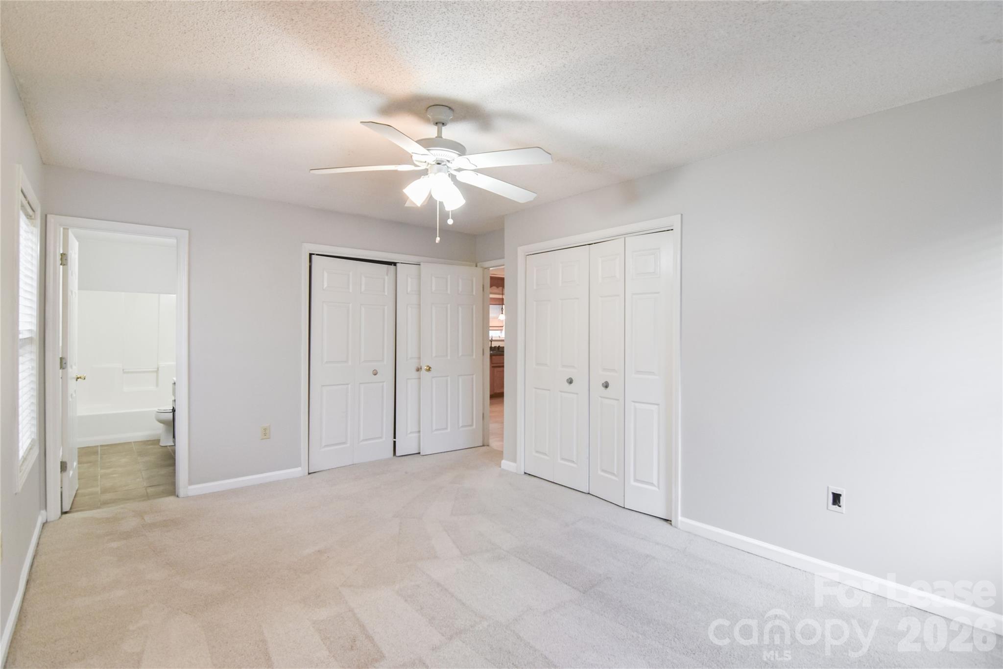110 Pratt Street Belmont, NC 28012 - Photo 3 of 18 an empty room with closet and a ceiling fan