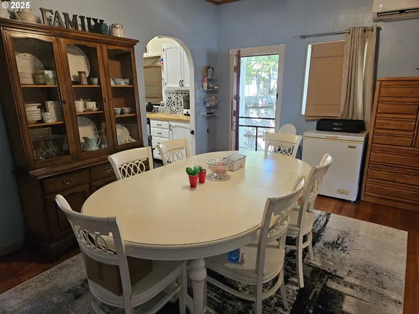 a dining room with furniture and chandelier