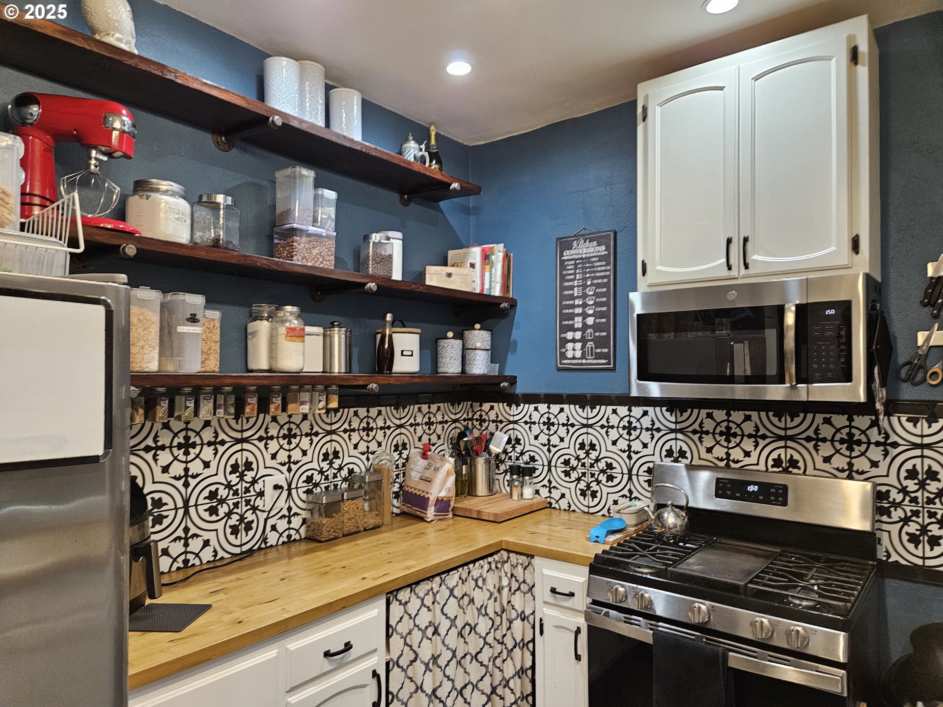 1040 Southeast 6th Avenue Albany, OR 97321 - Photo 14 of 48 a kitchen with stainless steel appliances a stove and a microwave