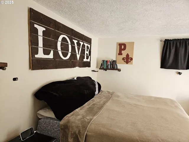 a view of walk in closet with clothes